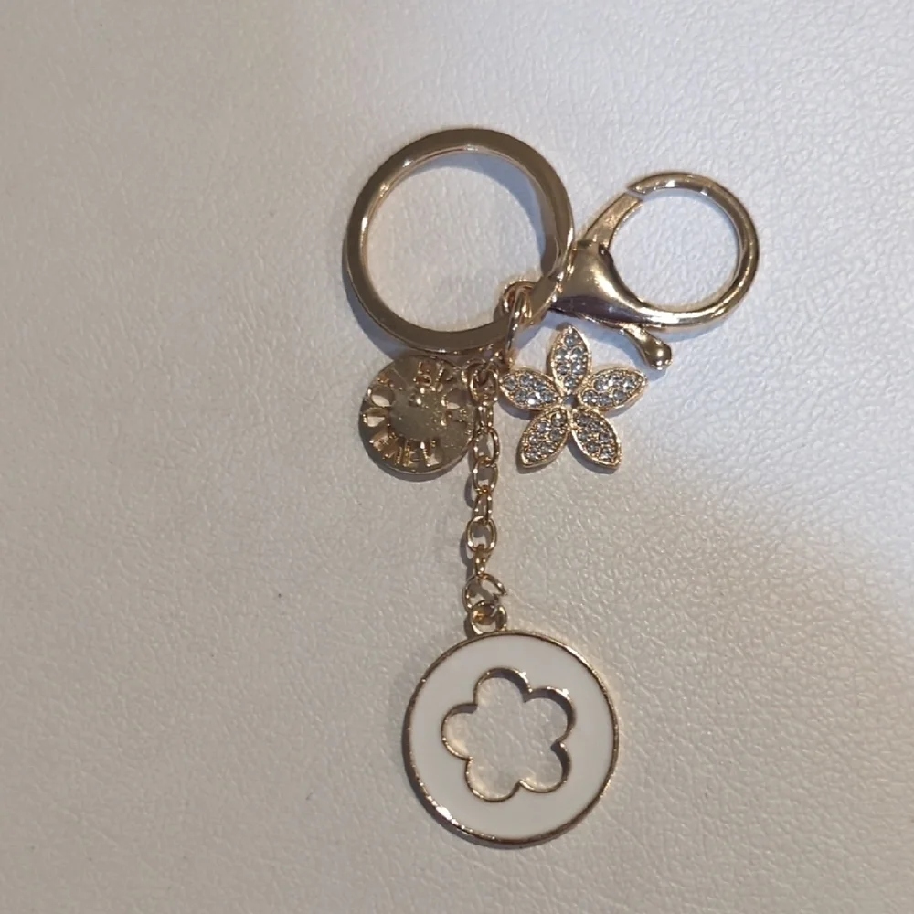 Elegant Gold Keychain with Floral Charm